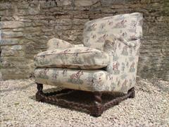 antique armchair made by Howard and Sons of London.jpg